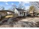 Charming single-story home with a covered parking area and a well-maintained front yard at 211 W Sycamore, Zebulon, NC 27597