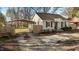 Cozy home with covered parking, complemented by a charming front yard and established trees at 211 W Sycamore, Zebulon, NC 27597