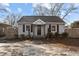 Charming home featuring a well-manicured front yard and a covered carport at 211 W Sycamore, Zebulon, NC 27597