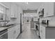 Beautiful kitchen with stainless steel appliances, white cabinets, and open layout at 211 W Sycamore, Zebulon, NC 27597