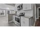Modern kitchen with stainless steel appliances, white cabinets, and subway tile backsplash at 211 W Sycamore, Zebulon, NC 27597