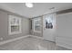 Bright mud room featuring tile floors, dual windows, and convenient door and bench storage at 211 W Sycamore, Zebulon, NC 27597