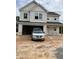 Two-story home featuring an attached garage and light siding complemented by crisp white trim at 228 Dove Rd, Cameron, NC 28326