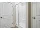 Clean bathroom featuring a glass enclosed shower with built in bench and subway tile at 2469 Englemann Dr # 366, New Hill, NC 27562
