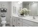 Stylish bathroom featuring double sinks with white countertops, modern fixtures, and floral accents at 2469 Englemann Dr # 366, New Hill, NC 27562