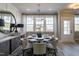 Elegant dining room with large windows and stylish chandelier at 2469 Englemann Dr # 366, New Hill, NC 27562