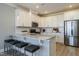 Modern kitchen with stainless steel appliances, granite countertops, and a breakfast bar at 2469 Englemann Dr # 366, New Hill, NC 27562