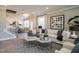Open-concept living room featuring neutral tones, stylish décor, and ample natural light at 2469 Englemann Dr # 366, New Hill, NC 27562
