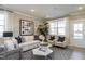 Bright living room featuring neutral tones, stylish decor, and plenty of natural light at 2469 Englemann Dr # 366, New Hill, NC 27562
