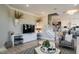 Bright living room featuring a modern sofa, stylish decor and an open view to the dining area at 2477 Englemann Dr # 370, New Hill, NC 27562