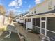 Backyards showing screened-in porches, fencing, and minimal landscaping at 2523 Spring Oaks Way, Raleigh, NC 27614