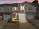 Charming townhome with stone accents, two-car garage, and cozy front porch in a desirable community at 2523 Spring Oaks Way, Raleigh, NC 27614