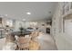 Open concept living and dining area with neutral colors, fireplace, and modern furnishings at 2523 Spring Oaks Way, Raleigh, NC 27614