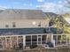 Townhome exterior featuring screened-in back porches and a fenced yard at 2523 Spring Oaks Way, Raleigh, NC 27614