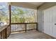 Outdoor balcony featuring wood floors, railings, and an exterior door at 2608 Broad Oaks Pl, Raleigh, NC 27603