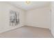 Empty bedroom with neutral carpet, ceiling fan, window and natural light at 2608 Broad Oaks Pl, Raleigh, NC 27603