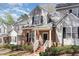 Townhouse exterior features brick accents, light gray siding, white trim, and a neatly landscaped front yard at 2608 Broad Oaks Pl, Raleigh, NC 27603