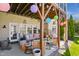 Back patio with decorative lighting and outdoor seating at 2613 Forest Lake Ct, Wake Forest, NC 27587