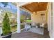 Inviting back porch with cozy seating and string lights at 2613 Forest Lake Ct, Wake Forest, NC 27587