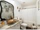 Unique bathroom featuring a gilded sink and mirror, creative design, and decorative accents at 2613 Forest Lake Ct, Wake Forest, NC 27587