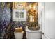 Charming powder room with dark floral wallpaper, unique sink, and vintage mirror at 2613 Forest Lake Ct, Wake Forest, NC 27587