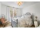 Cozy bedroom with a vintage-style bed frame, soft color palette, and natural light at 2613 Forest Lake Ct, Wake Forest, NC 27587