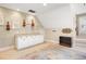 Bonus room features custom cabinets and shelving, ideal for storage and hobbies, and a beautiful decorative rug at 2613 Forest Lake Ct, Wake Forest, NC 27587