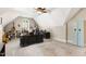 Spacious home office with a large desk, guitars, vaulted ceilings, and natural light at 2613 Forest Lake Ct, Wake Forest, NC 27587