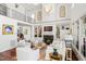 Grand living room featuring a fireplace, built-in shelving, and elegant furnishings at 2613 Forest Lake Ct, Wake Forest, NC 27587