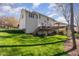 Expansive backyard view highlighting the deck, mature trees, and the home's exterior at 2900 London Bell Dr, Raleigh, NC 27614