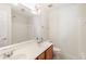 Bright bathroom featuring double sinks, modern fixtures, and a shower with white tiling at 2900 London Bell Dr, Raleigh, NC 27614