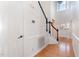 Bright foyer with hardwood floors, staircase, and a decorative glass front door at 2900 London Bell Dr, Raleigh, NC 27614