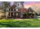Beautiful brick home with manicured lawn, a fountain, and inviting curb appeal at 2900 London Bell Dr, Raleigh, NC 27614
