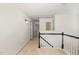 Upstairs hallway with carpet and view of the staircase at 2900 London Bell Dr, Raleigh, NC 27614