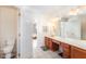 Main bathroom with double sink vanity and tiled floor at 2900 London Bell Dr, Raleigh, NC 27614