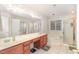 Main bathroom with double sinks, soaking tub, and glass enclosed shower at 2900 London Bell Dr, Raleigh, NC 27614