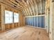 Unfinished attic space with windows and exposed framing at 2957 Wexford Pond Way, Wake Forest, NC 27587