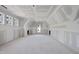 Spacious bedroom featuring unfinished drywall, multiple windows, and lots of natural light at 2957 Wexford Pond Way, Wake Forest, NC 27587