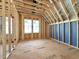 Bedroom framing featuring natural light, electrical pre-wiring and unfinished interior design at 2957 Wexford Pond Way, Wake Forest, NC 27587