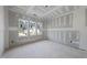 Bedroom with three windows allowing an abundance of natural light into the unfinished room at 2957 Wexford Pond Way, Wake Forest, NC 27587