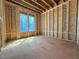 Unfinished bedroom provides a bright view through large windows and a glimpse of its layout at 2957 Wexford Pond Way, Wake Forest, NC 27587