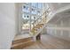A spacious entryway with staircase and lots of windows at 2957 Wexford Pond Way, Wake Forest, NC 27587