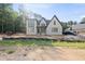 Striking two-story new construction home with brick and siding and an attached garage at 2957 Wexford Pond Way, Wake Forest, NC 27587