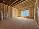 Unfinished room interior with exposed wooden beams and multiple windows at 2957 Wexford Pond Way, Wake Forest, NC 27587