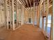 Unfinished interior showing exposed wood studs and utilities during construction at 2957 Wexford Pond Way, Wake Forest, NC 27587