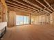 Unfinished living room showcases an open-concept design with sliding glass doors to provide natural light at 2957 Wexford Pond Way, Wake Forest, NC 27587