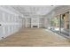 Open-concept living room featuring a fireplace, sliding glass doors, and hardwood floors at 2957 Wexford Pond Way, Wake Forest, NC 27587