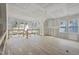 An unfinished open loft area with hardwood floors and many windows at 2957 Wexford Pond Way, Wake Forest, NC 27587
