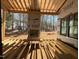 Covered patio area featuring wood framing, an outdoor fireplace, and views of the backyard at 2957 Wexford Pond Way, Wake Forest, NC 27587