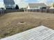 View of back yard and wood fence at 30 Wheat Dr, Angier, NC 27501